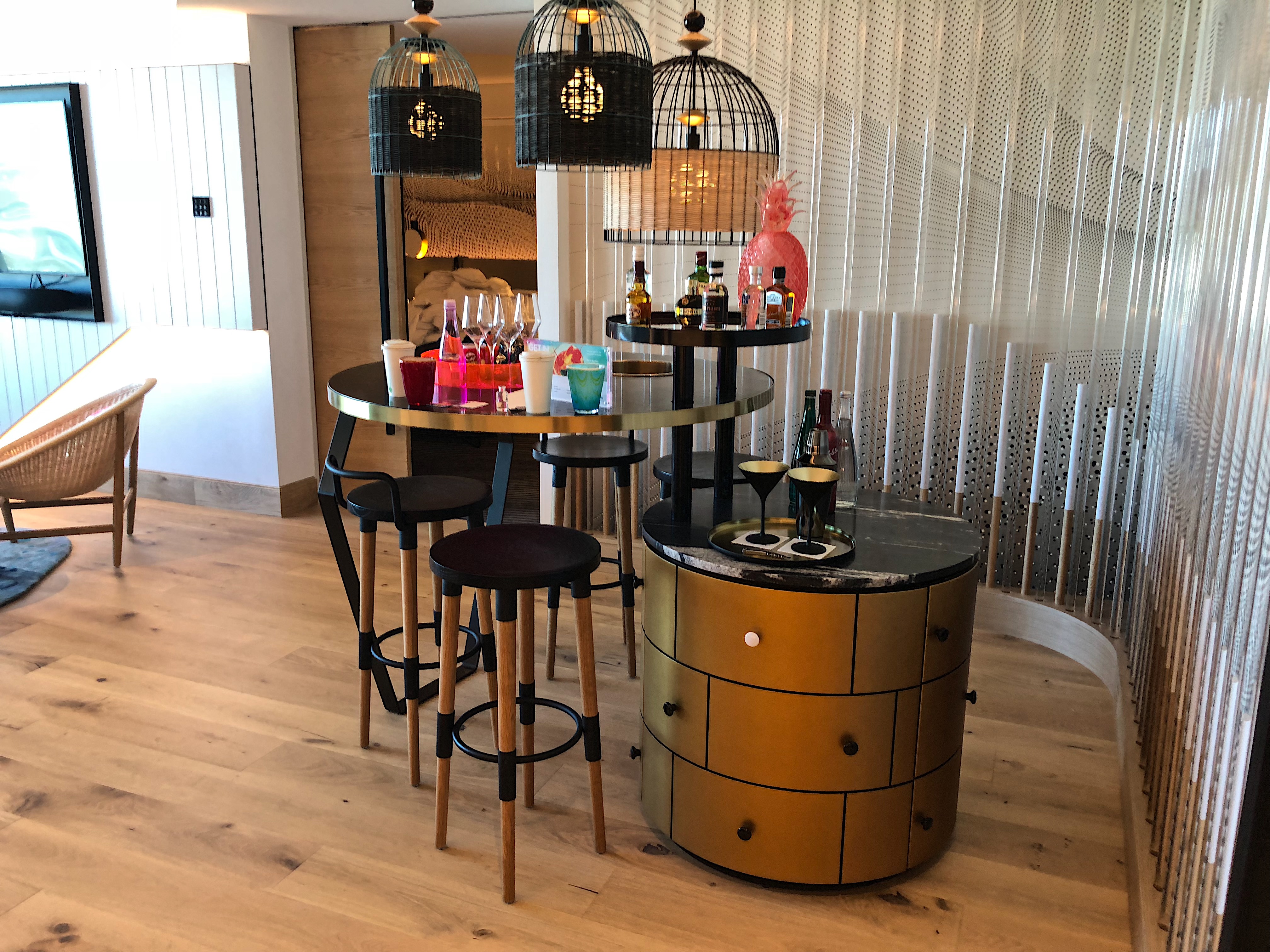 a bar with a table and stools