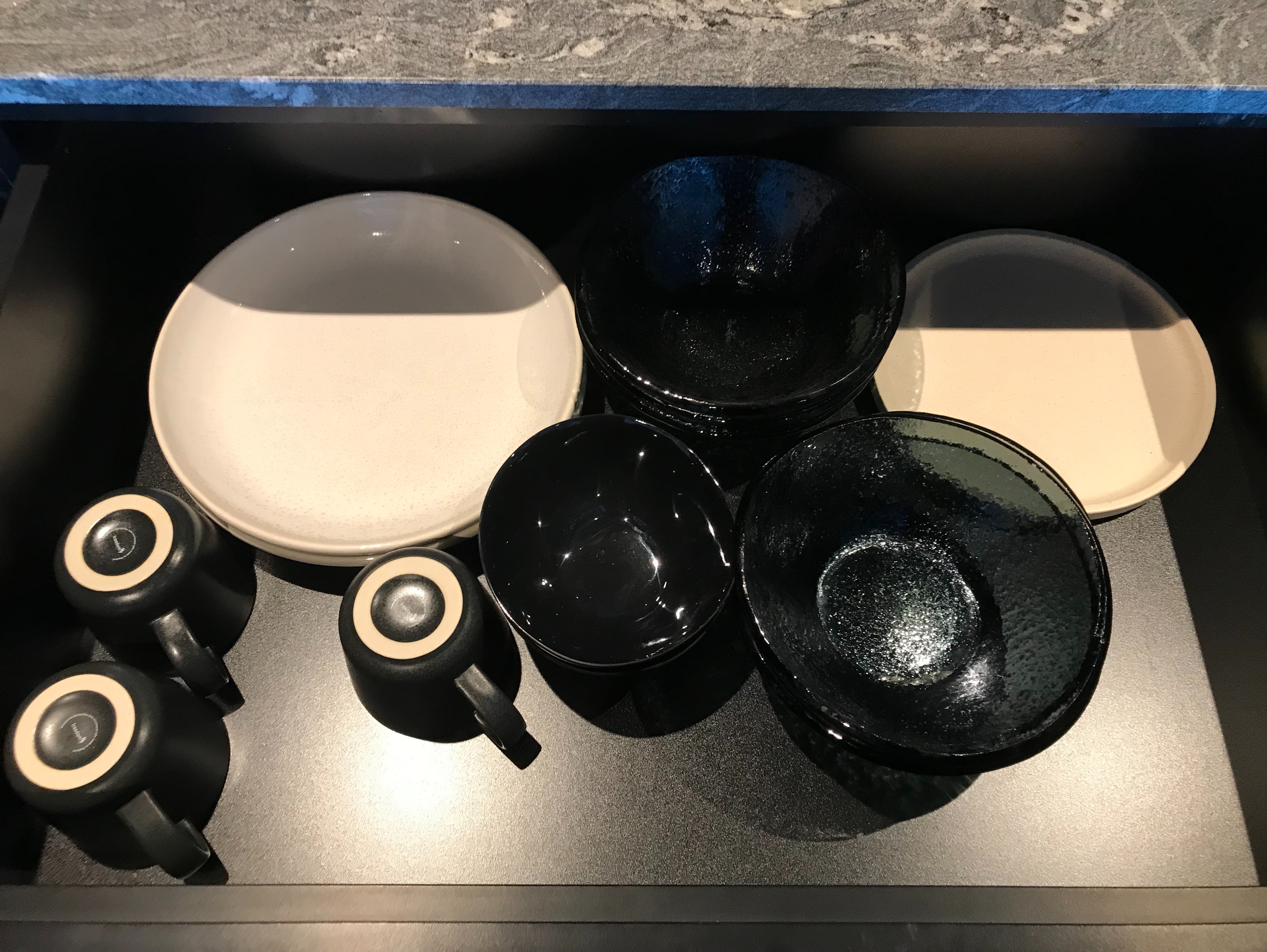 a group of black and white dishes