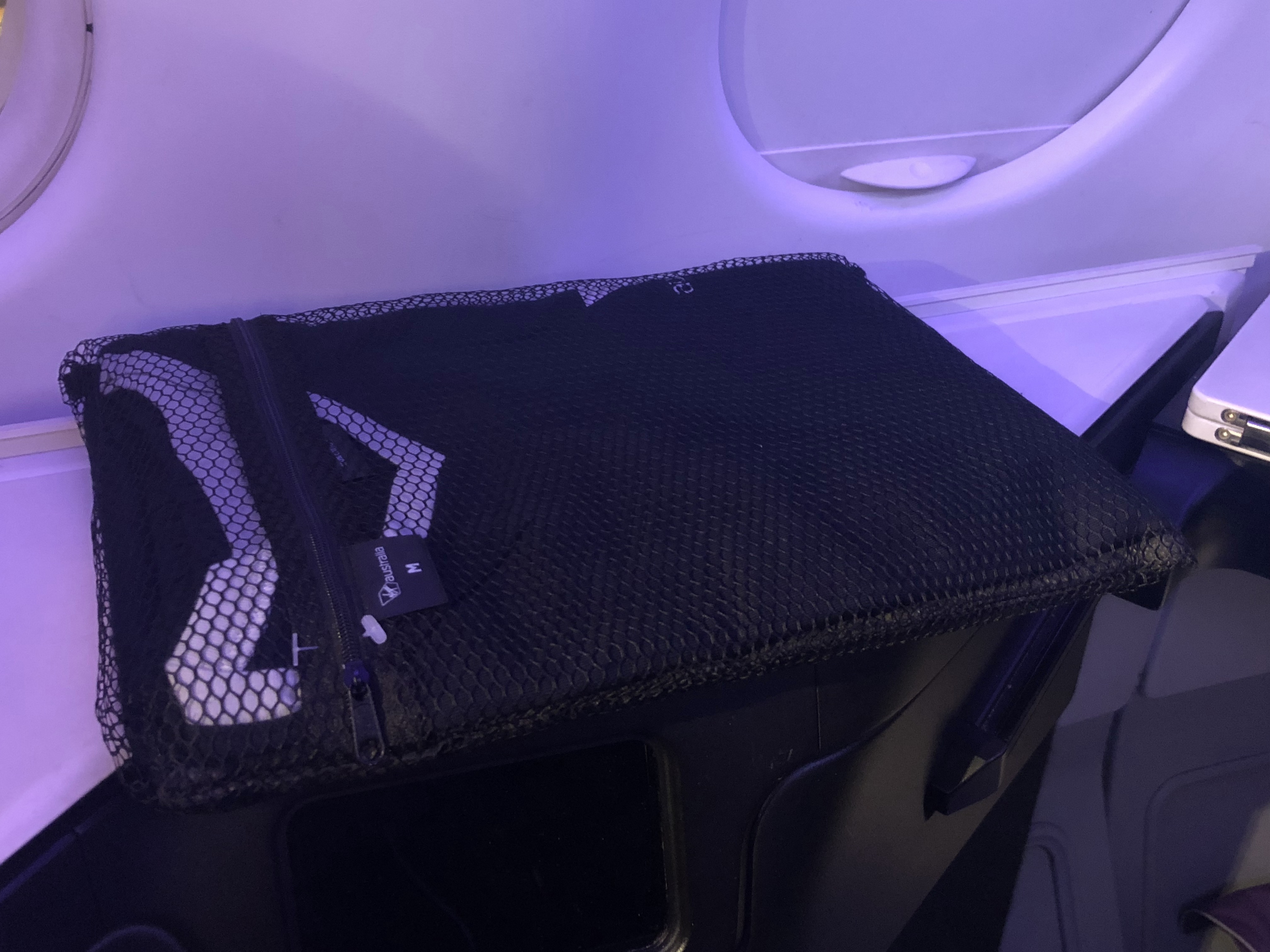 a black bag on a plane