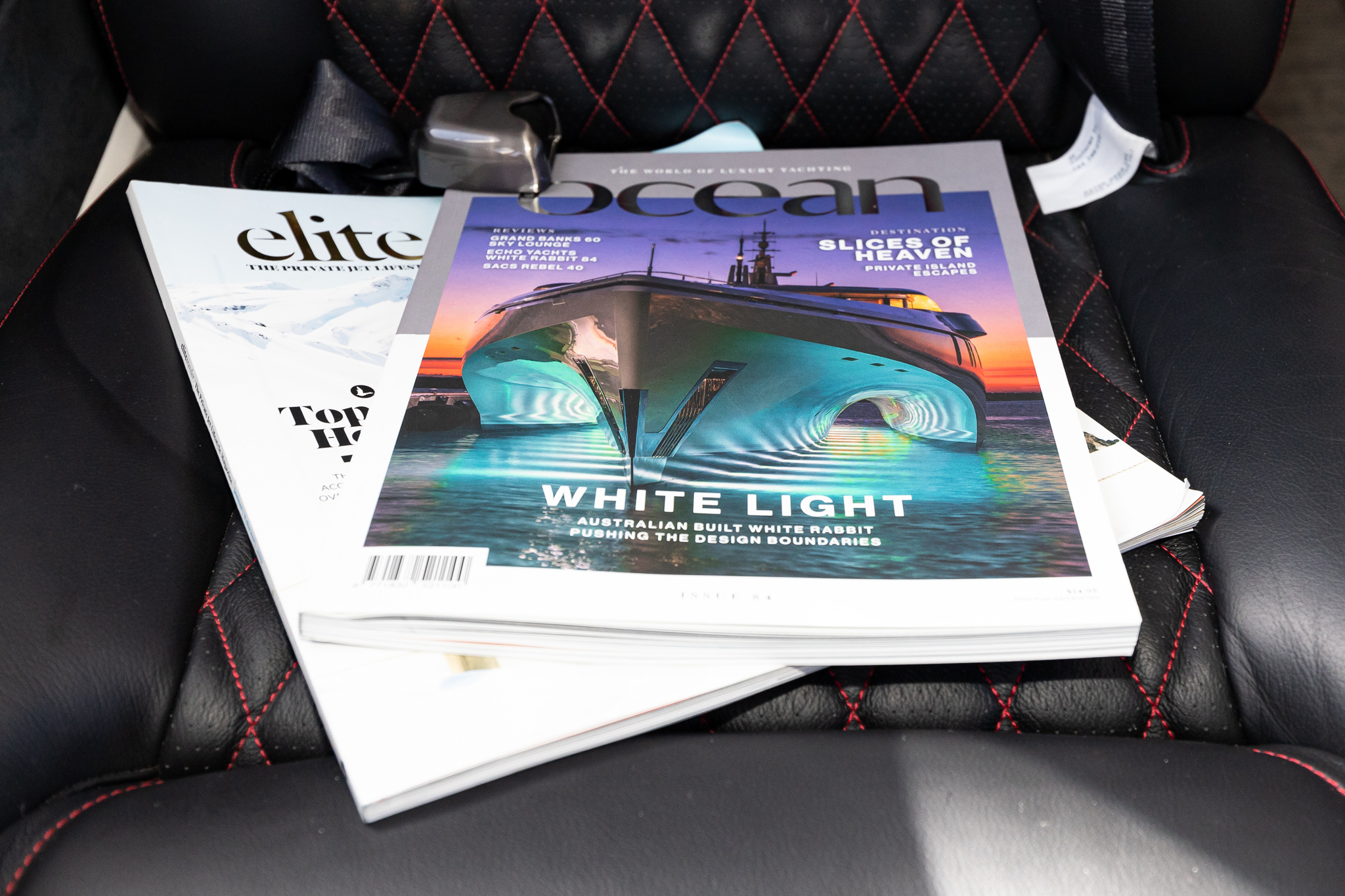 a stack of magazines in a car seat