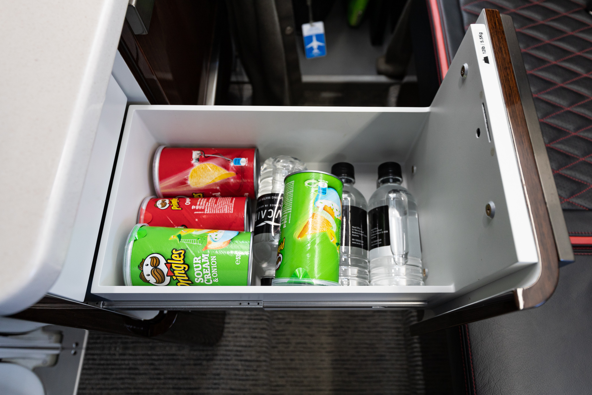 a drawer with drinks and cans inside