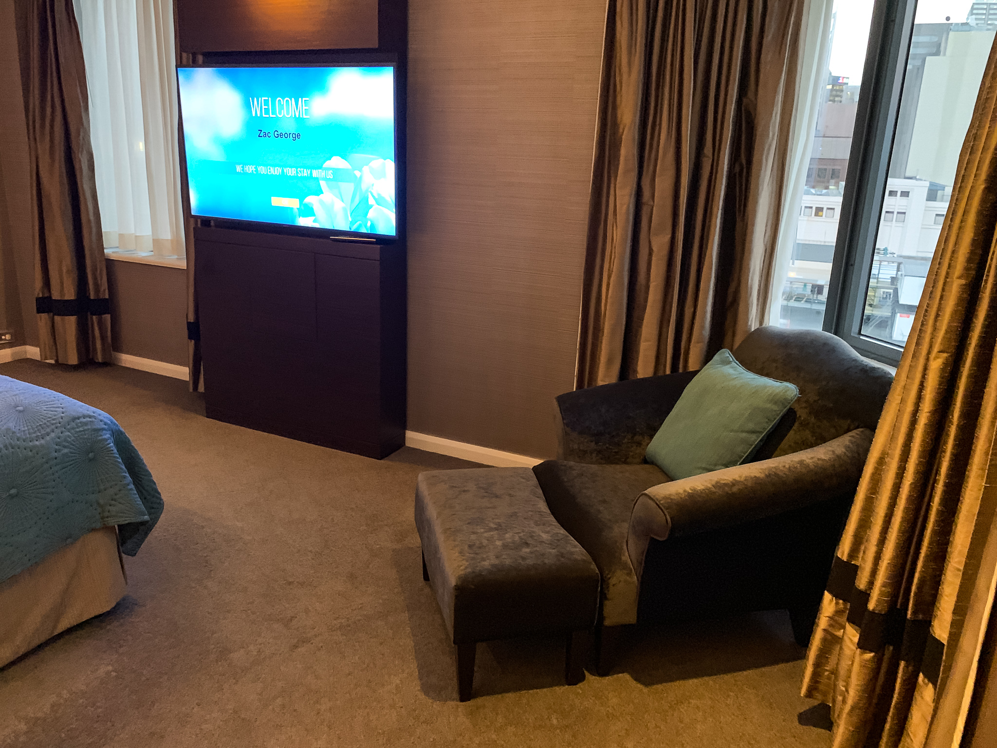 a room with a television and a chair
