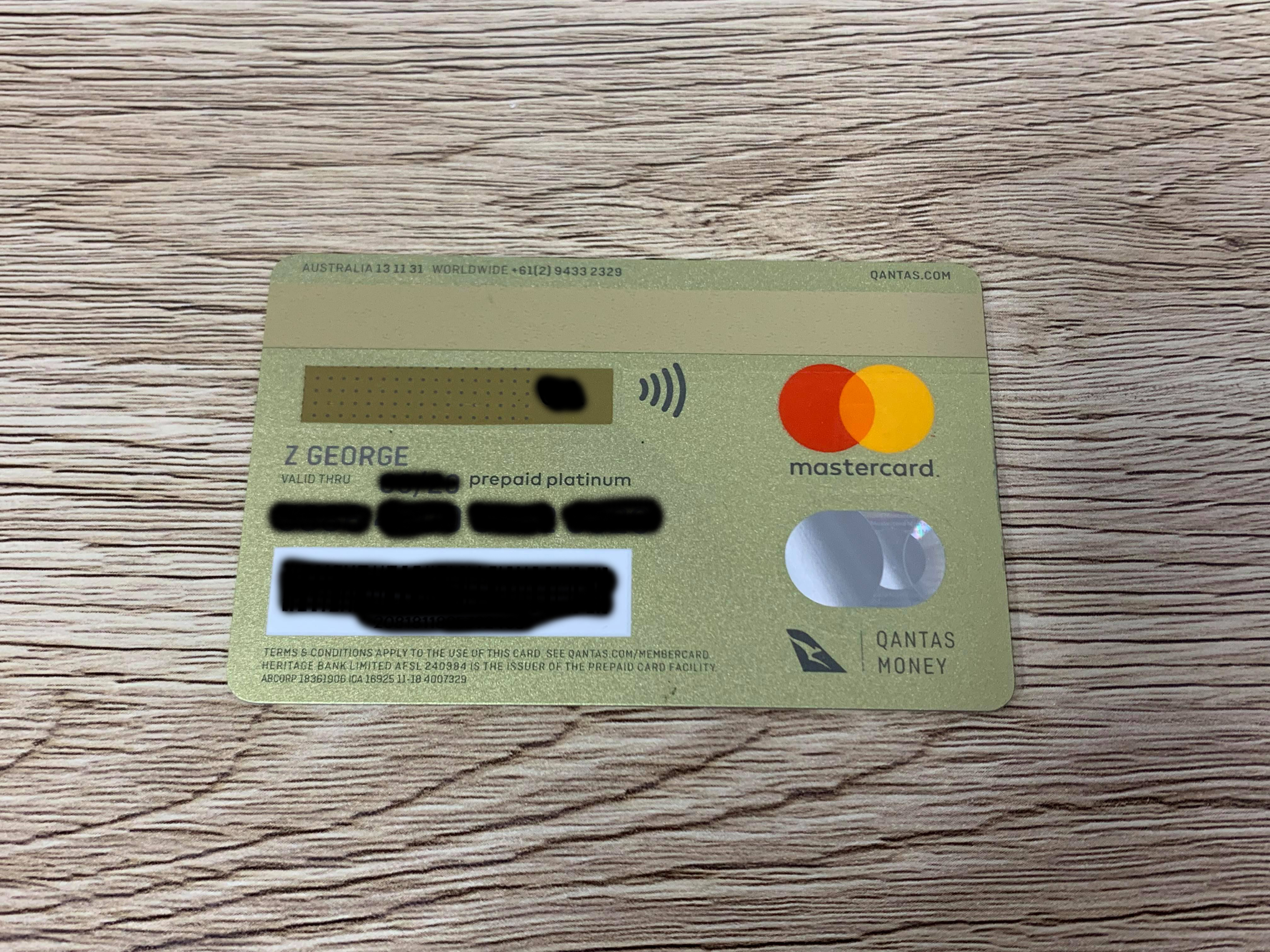 a credit card on a wood surface