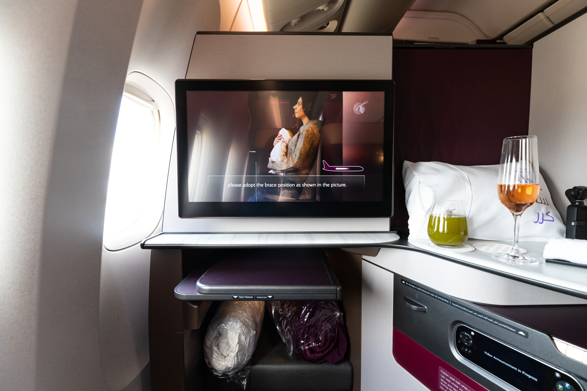 a tv on a shelf in an airplane