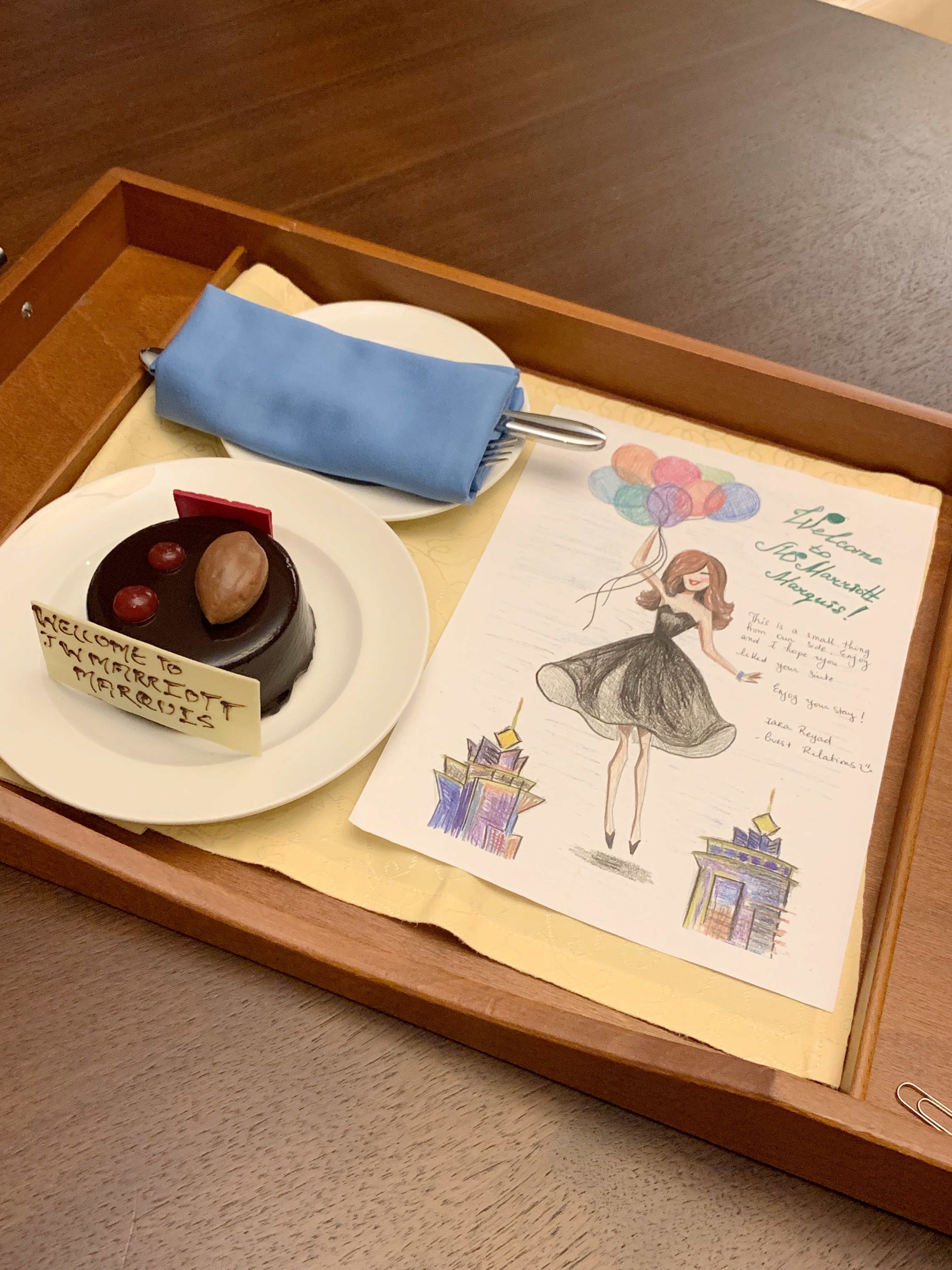 a tray with a piece of paper and a cake