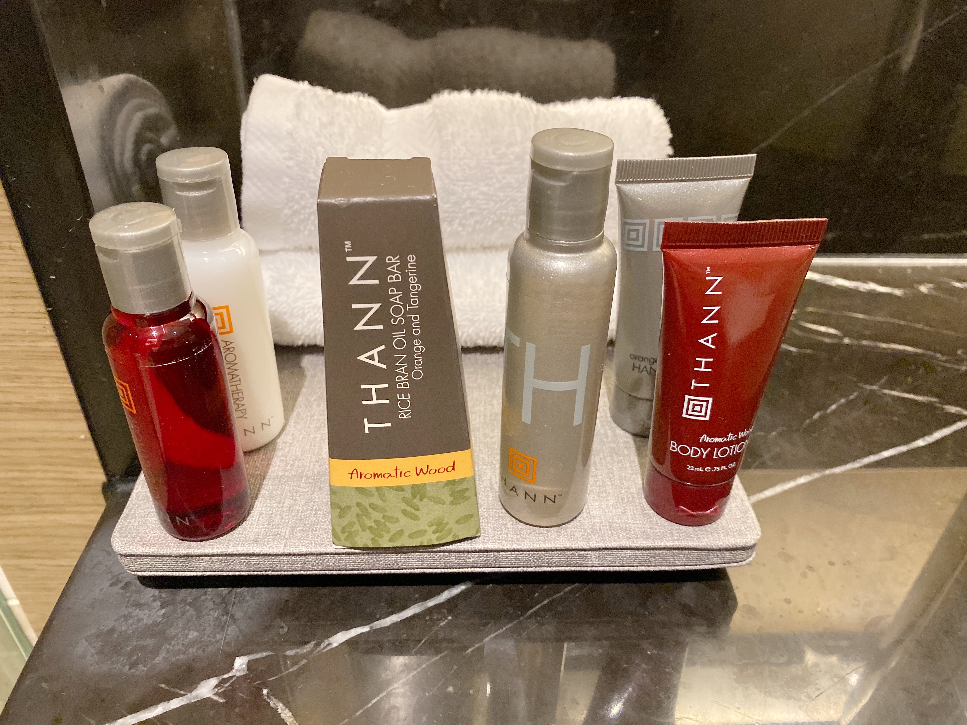 a group of bottles of cosmetics on a tray