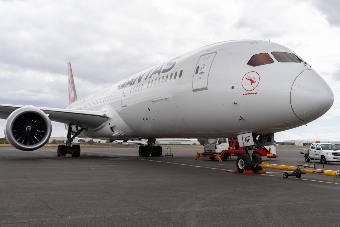 a large white airplane on a tarmac