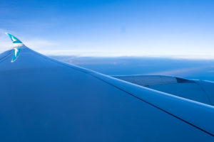 an airplane wing and blue sky