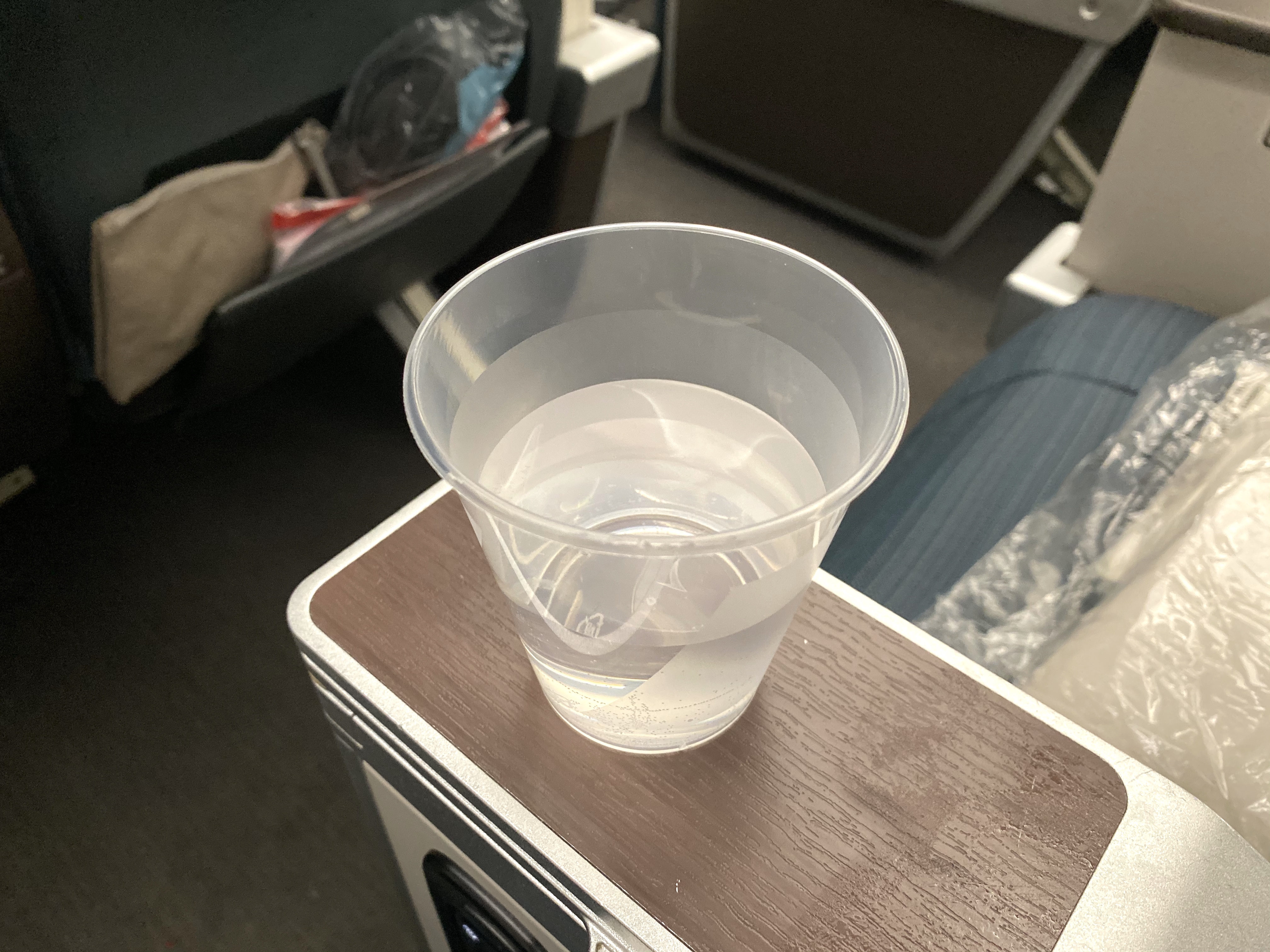 a plastic cup of water on a table