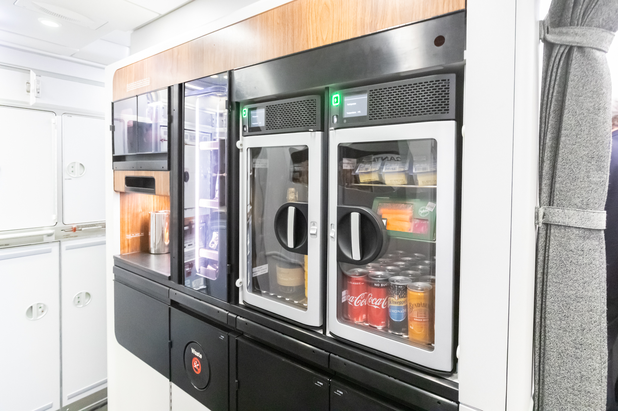 a beverage coolers with drinks in the door