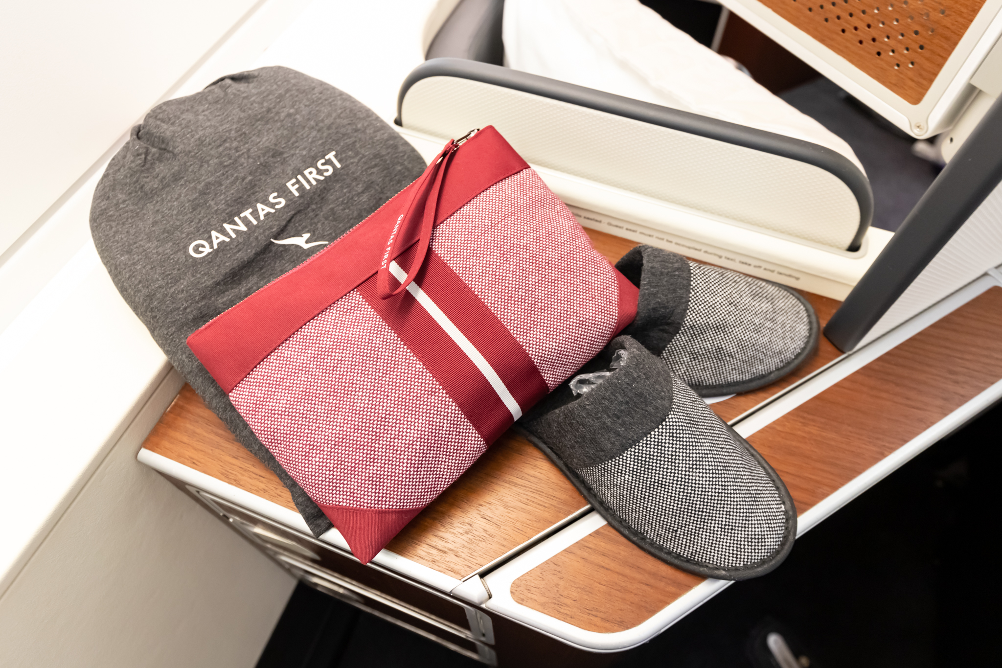 a bag and slippers on a desk