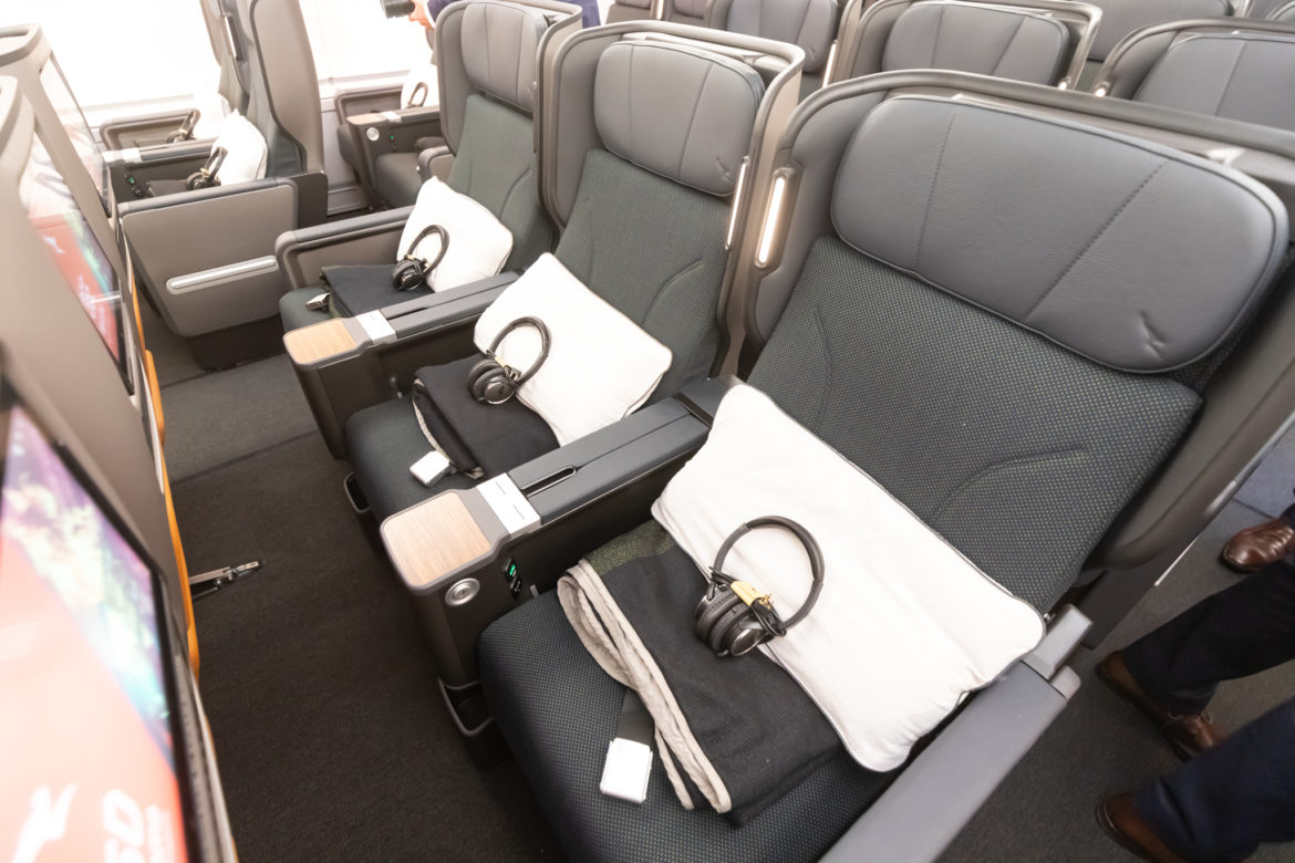 a row of seats with headphones on the side