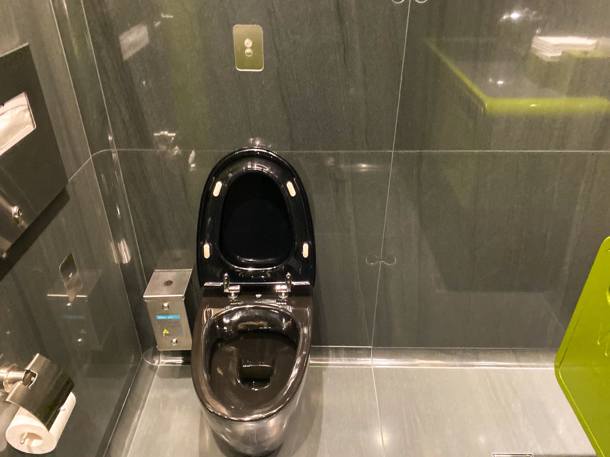 a black toilet in a bathroom