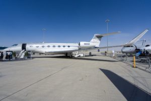 a white airplane on a runway