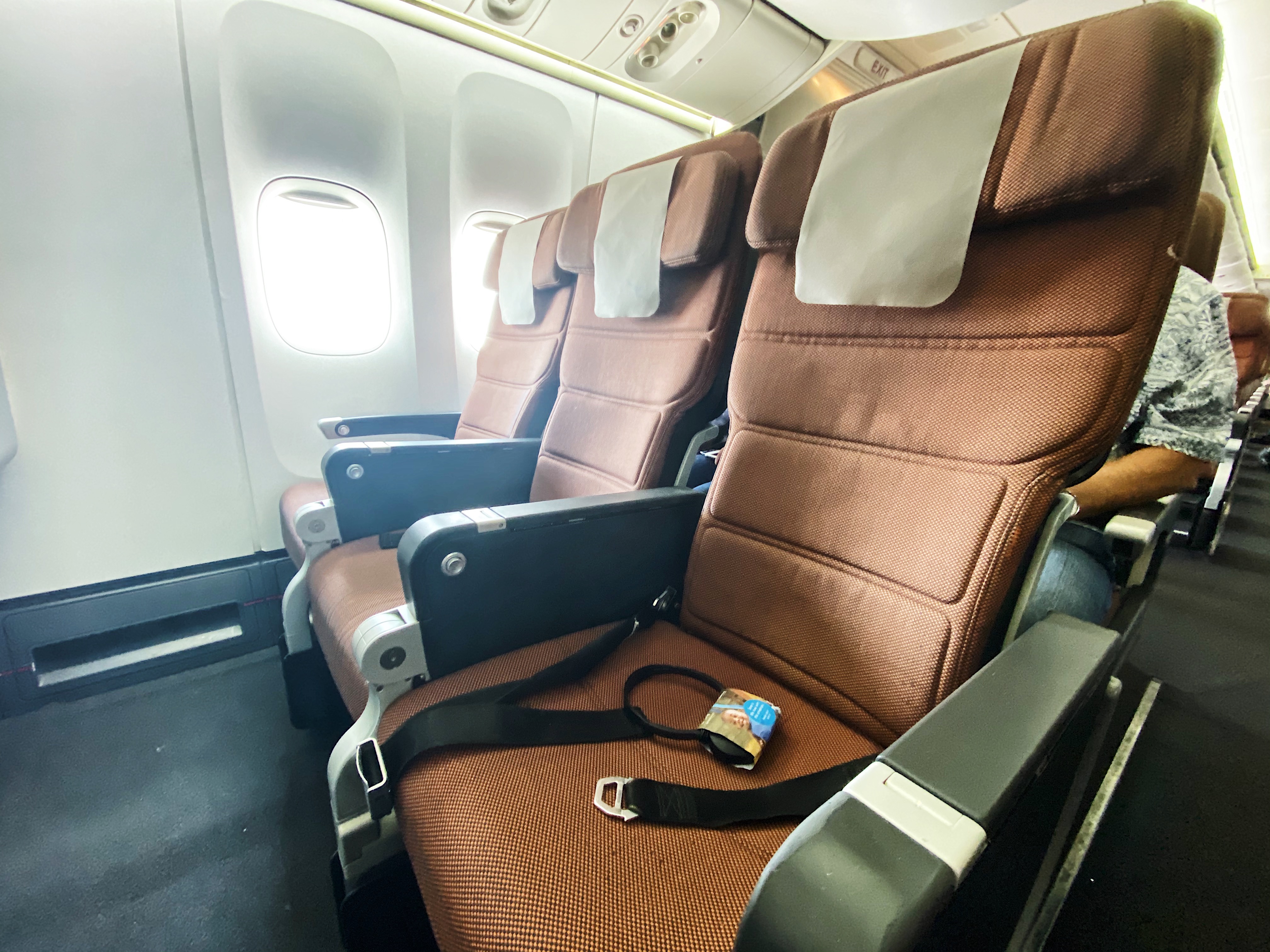 seats in an airplane with a seat belt and a seat belt