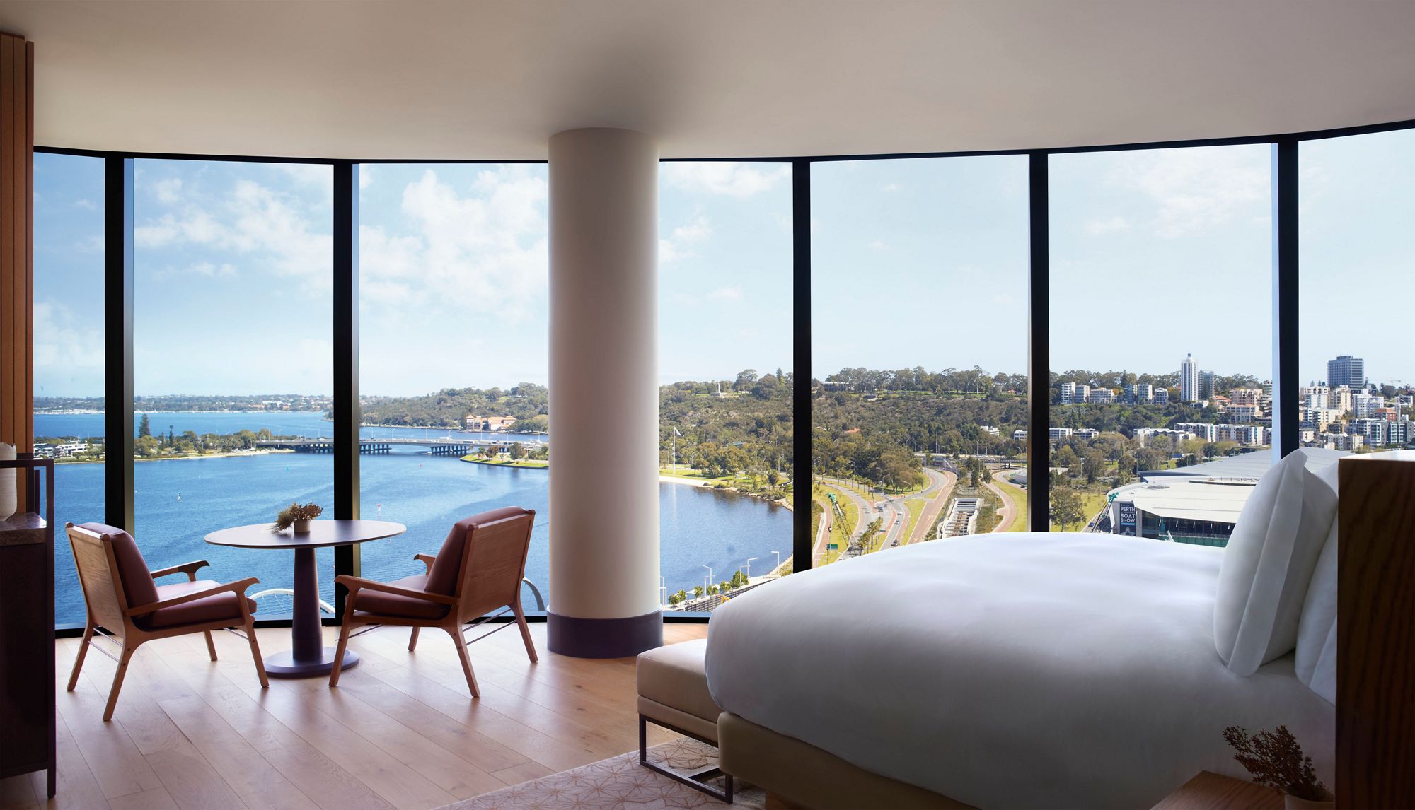 a room with a large window overlooking a body of water