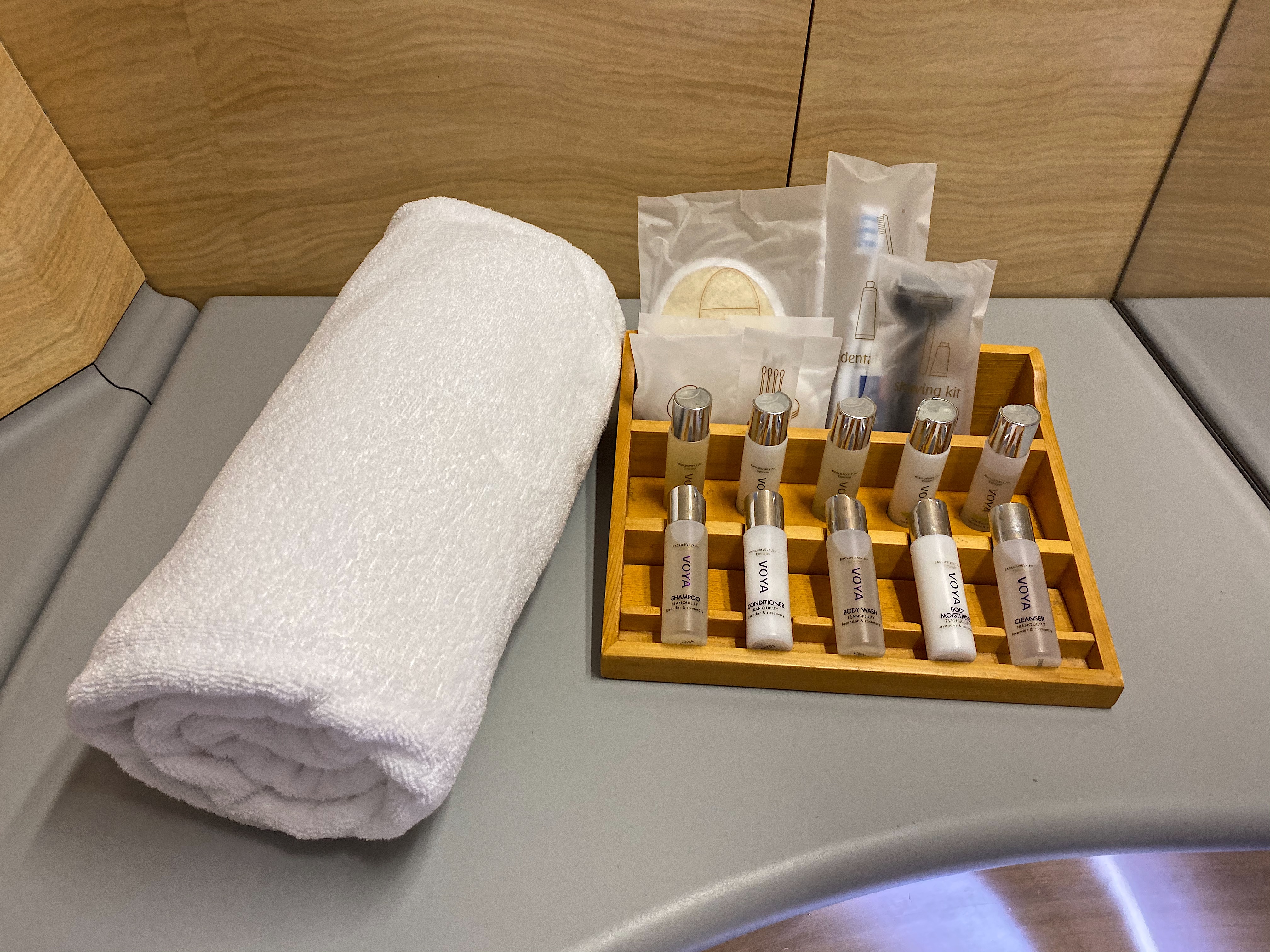 a white towel and a tray of small bottles