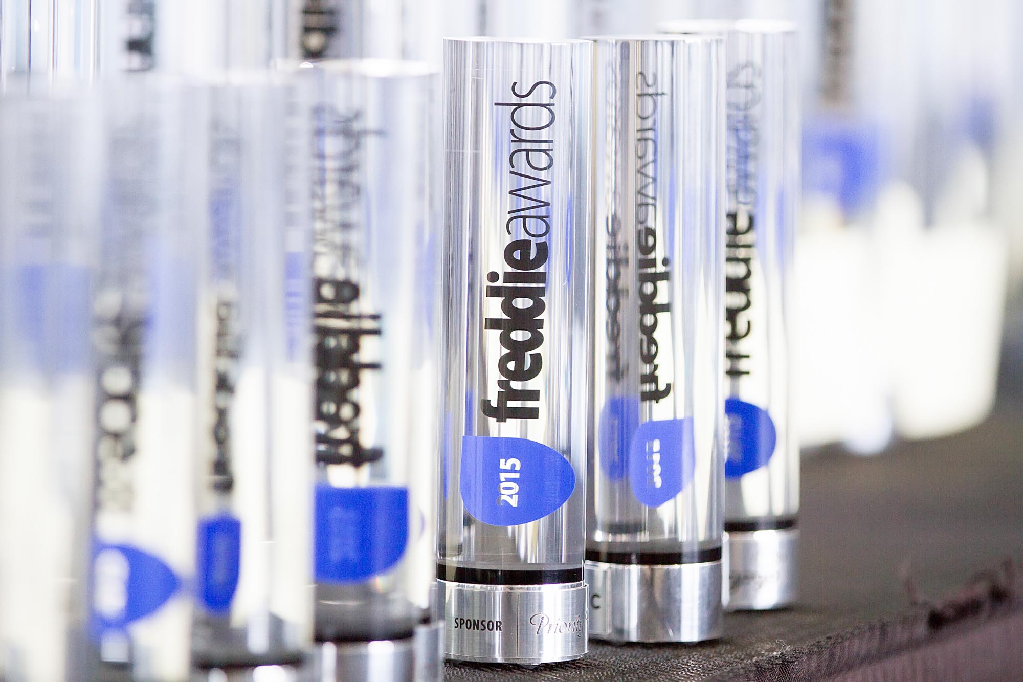 a group of clear tubes with blue labels