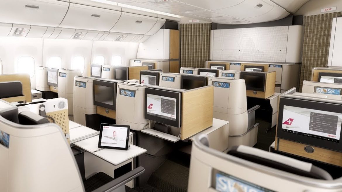 a room with rows of computers and desks