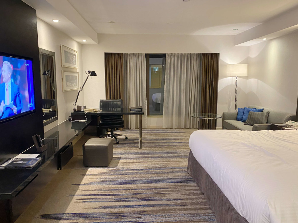 a room with a bed and a desk