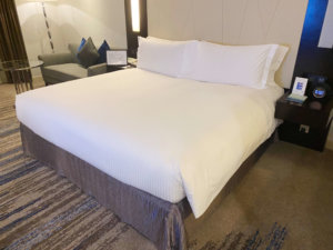 a bed with white sheets