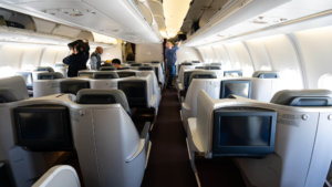 a group of people standing in an airplane