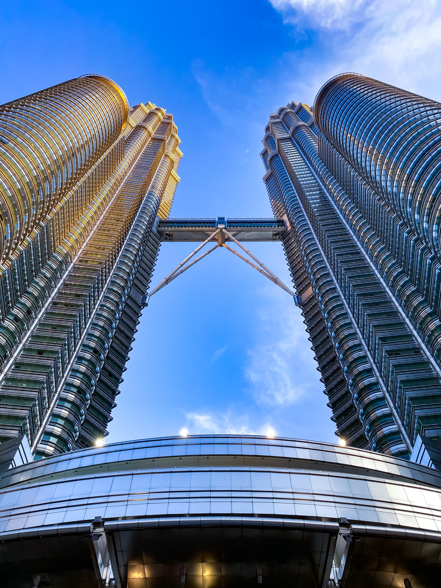 looking up view of two tall buildings