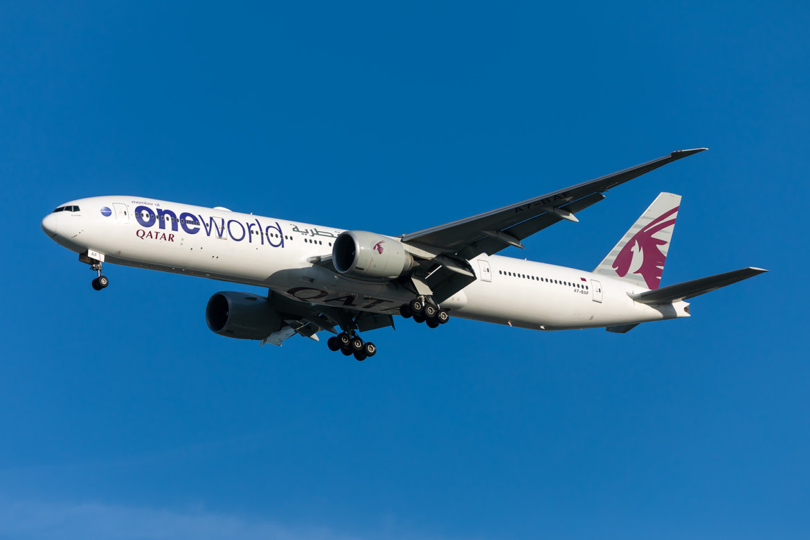 a white airplane flying in the sky