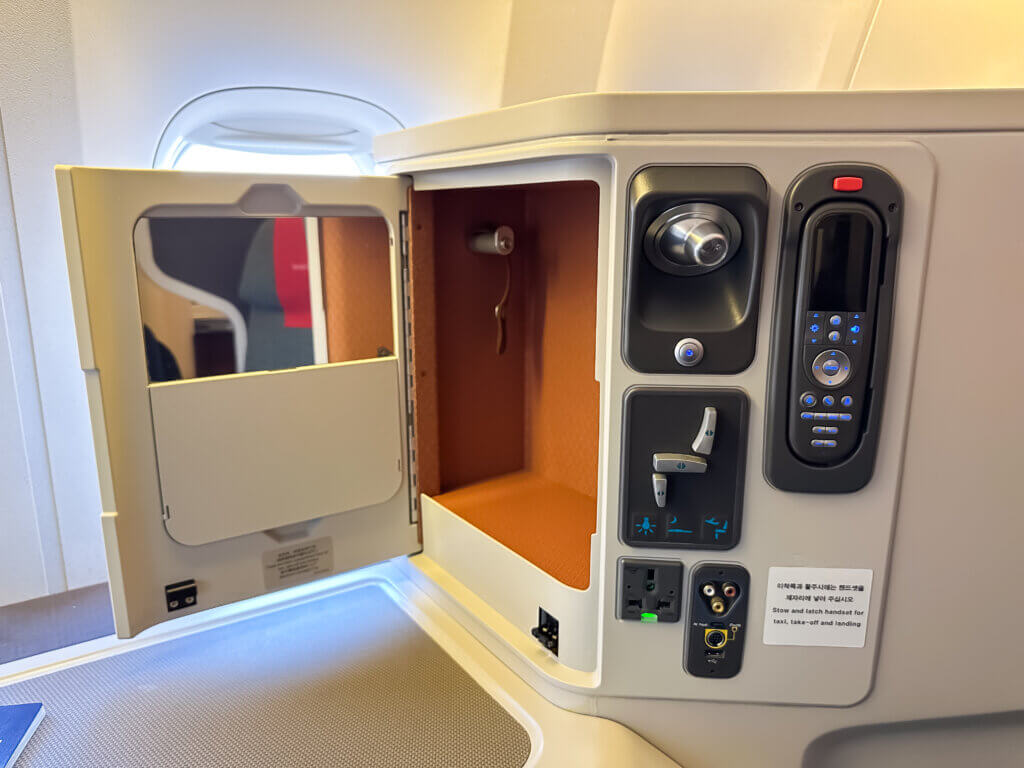an airplane cabin with a door open